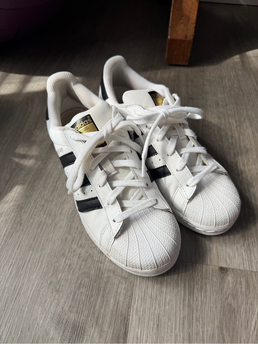 adidas Kids White Sneakers with Black Stripes and Gold Tongue Detail